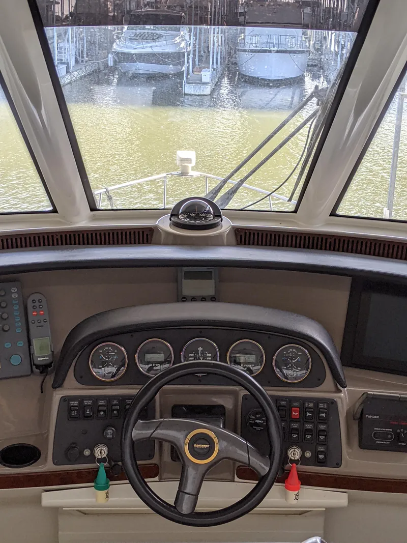 Slide: The Image of Helm of 2000 Carver 506 Motor Yacht with steering wheel and control panel. - 15