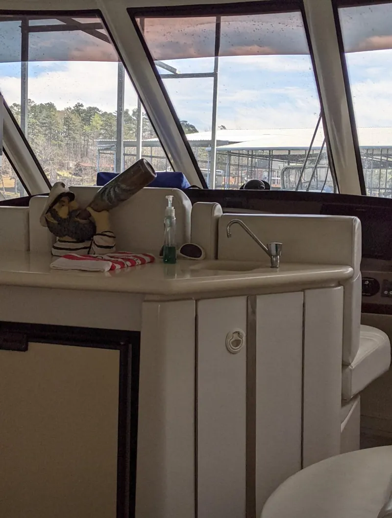 Slide: The Image of Interior of 2000 Carver 506 Motor Yacht with kitchenette and panoramic windows. - 16