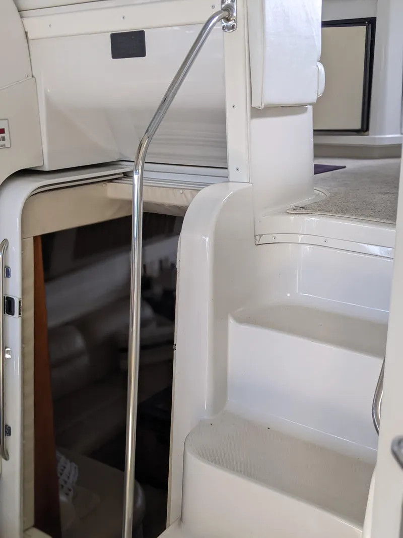 Slide: The Image of Interior stairs of 2000 Carver 506 Motor Yacht with chrome handrail. - 19