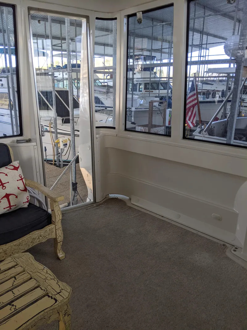 Slide: The Image of Interior view of 2000 Carver 506 Motor Yacht with marina background. - 20