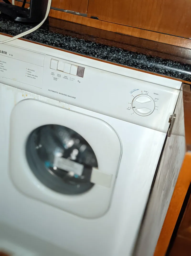 Slide: The Image of Washing machine inside a 2000 Carver 506 Motor Yacht. - 24