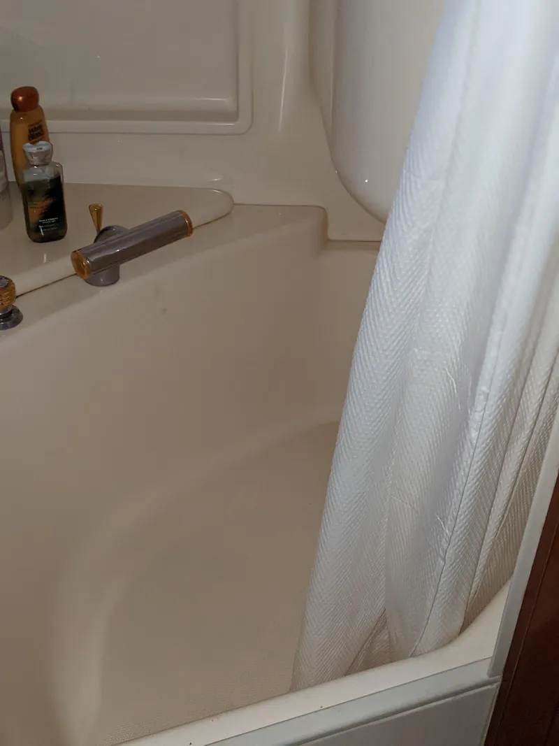 Slide: The Image of Bathtub in a 2000 Carver 506 Motor Yacht with toiletries and shower curtain. - 26