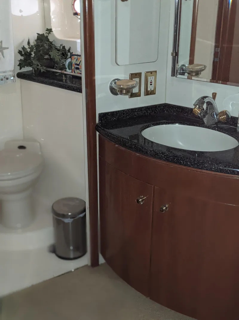 Slide: The Image of Bathroom interior of a 2000 Carver 506 Motor Yacht with sink and toilet. - 27