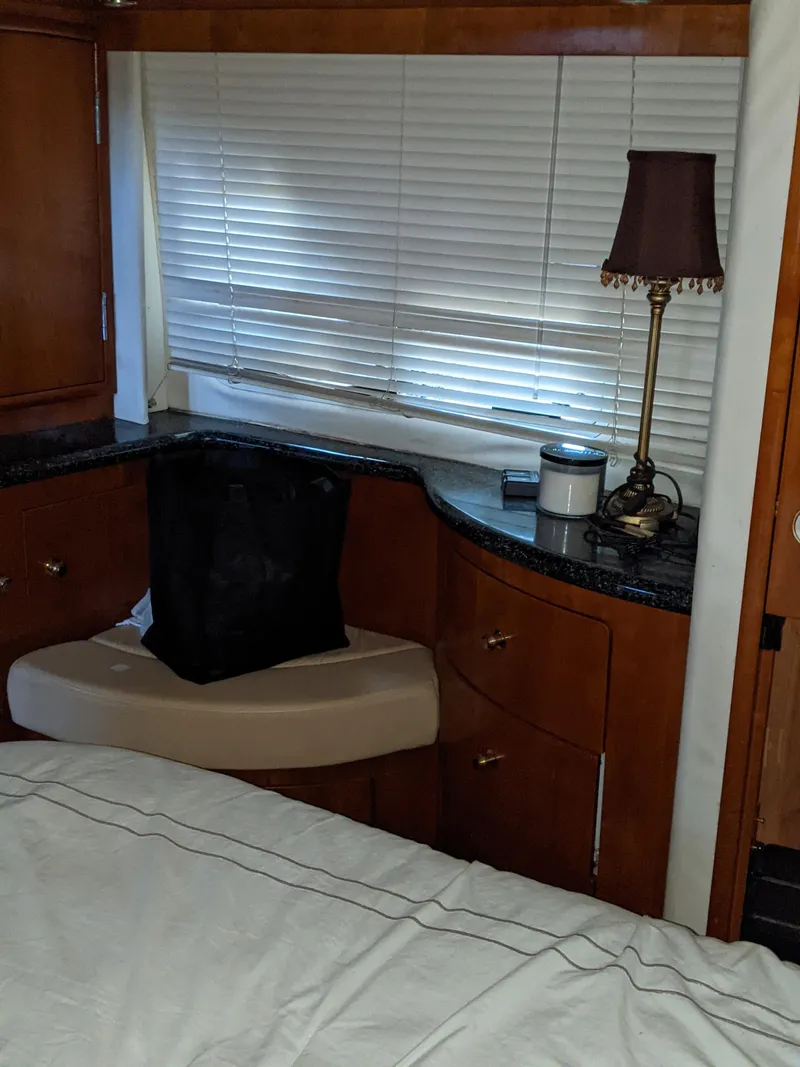 Slide: The Image of Interior cabin of a 2000 Carver 506 Motor Yacht with wooden cabinetry. - 28