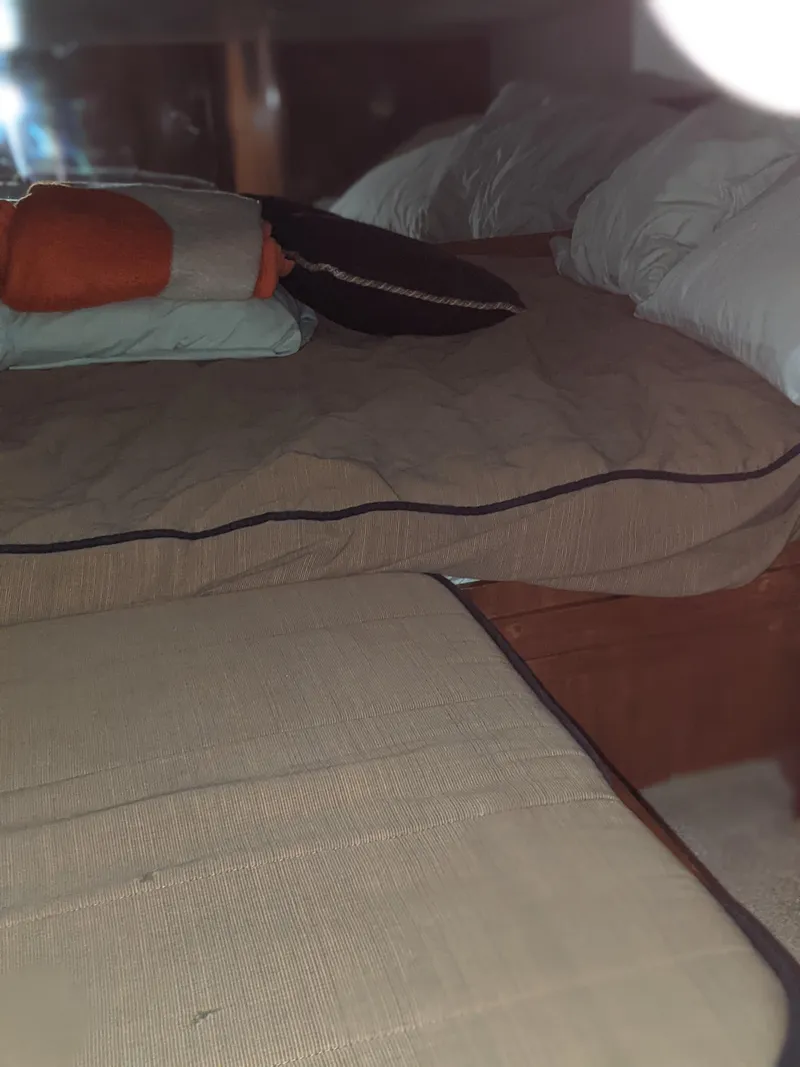 Slide: The Image of Interior cabin of a 2000 Carver 506 Motor Yacht with bed and pillows. - 33