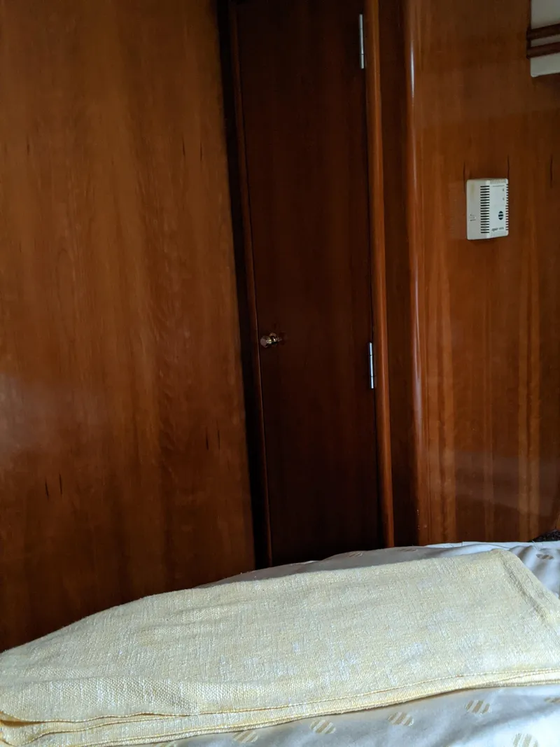 Slide: The Image of Interior cabin of a 2000 Carver 506 Motor Yacht with wooden paneling. - 38