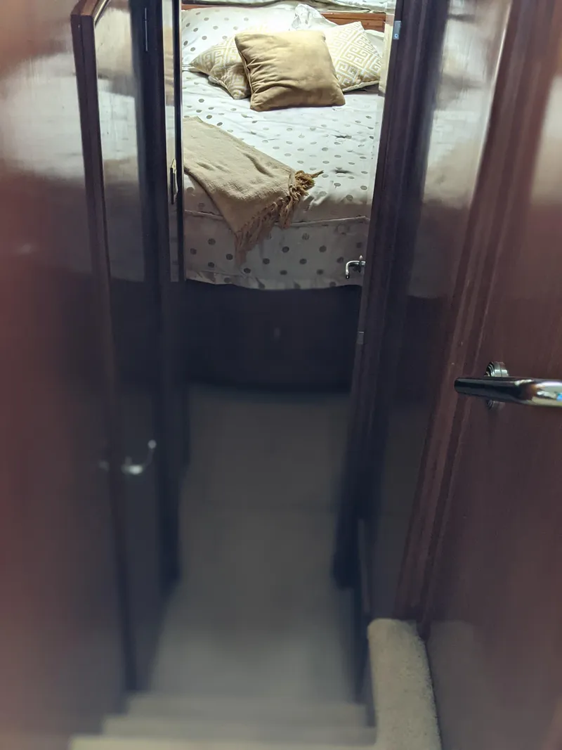 Slide: The Image of Interior view of 2000 Carver 506 Motor Yacht bedroom with bed and pillows. - 40