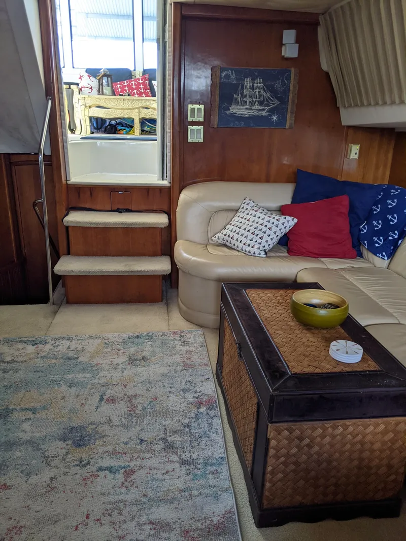 Slide: The Image of Interior of 2000 Carver 506 Motor Yacht with cozy seating and nautical decor. - 47