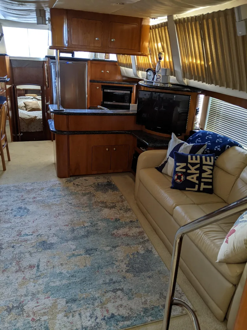 Slide: The Image of Interior of a 2000 Carver 506 Motor Yacht with kitchen and seating area. - 49