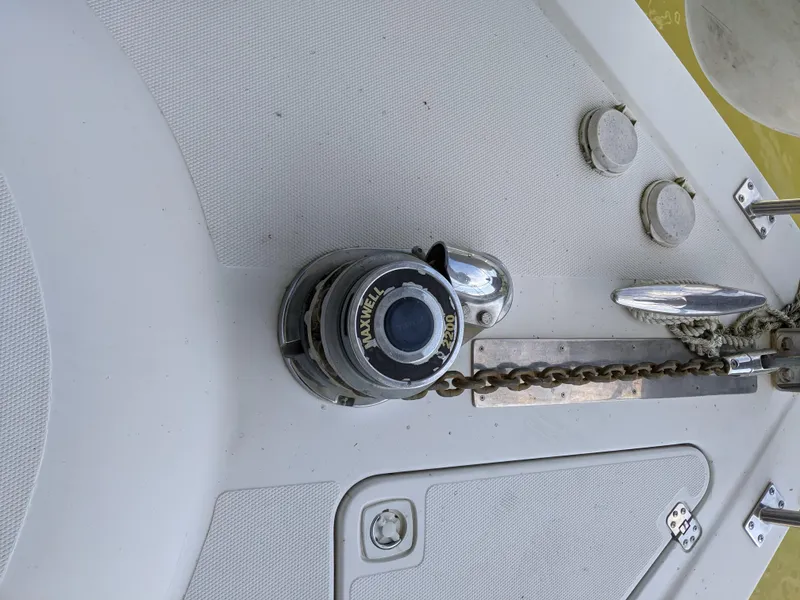 Slide: The Image of 2000 Carver 506 Motor Yacht anchor windlass and chain on deck - 5