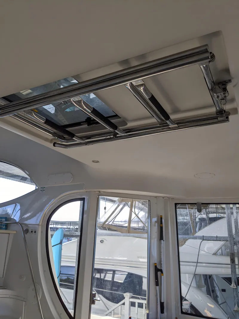 Slide: The Image of Interior view of 2000 Carver 506 Motor Yacht with skylight and docked boats. - 8