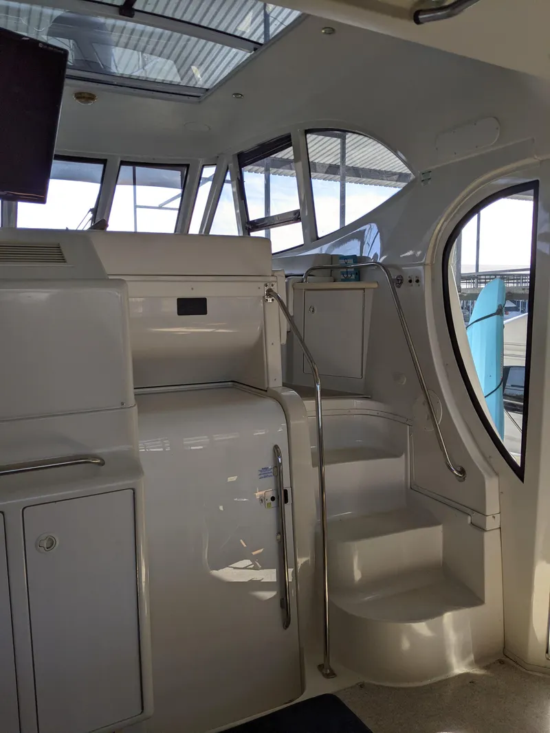 Slide: The Image of Interior view of 2000 Carver 506 Motor Yacht with stairs and windows. - 9