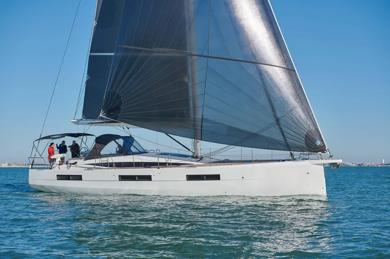 The Image of 2024 Jeanneau 60 sailing yacht on open water, featuring sleek design and modern sails. - 0