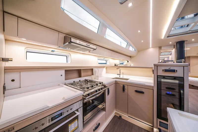 Slide: The Image of Luxurious 2024 Jeanneau 65 yacht kitchen with modern appliances and sleek design. - 21
