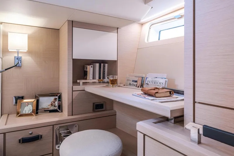 Slide: The Image of Luxurious interior of 2024 Jeanneau 65 yacht with elegant desk and decor. - 27