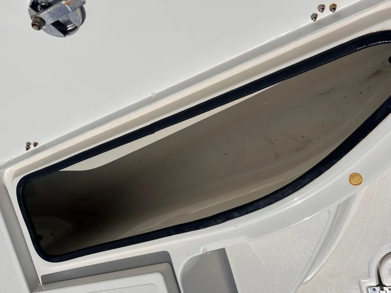 Slide: The Image of 2015 Triton 240 LTS boat storage compartment, open and empty. - 14