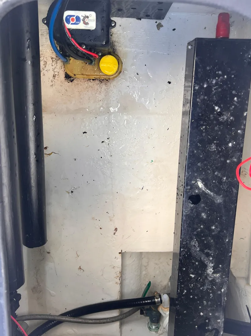 Slide: The Image of 2015 Triton 240 LTS boat interior wiring and components. - 28