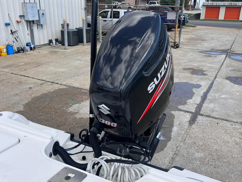 Slide: The Image of 2015 Triton 240 LTS boat with Suzuki 300 outboard motor. - 29