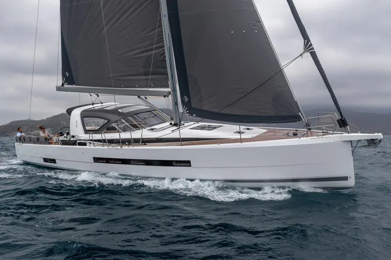 The Image of 2024 Jeanneau Yacht 55 sailing on open water, showcasing sleek design and modern features. - 0