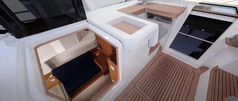 Slide: The Image of 2024 Jeanneau Yacht 55 interior view with modern design and wooden accents. - 16