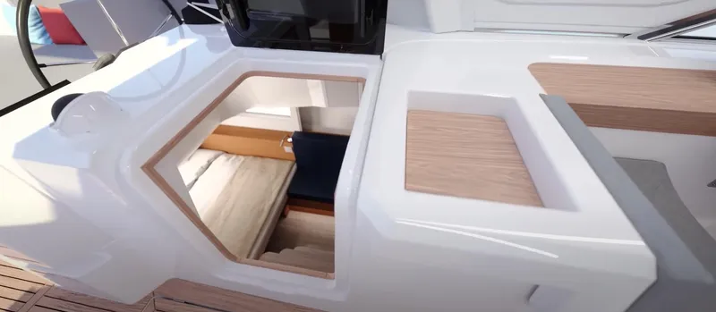Slide: The Image of 2024 Jeanneau Yacht 55 interior with sleek design and modern wood finishes. - 23