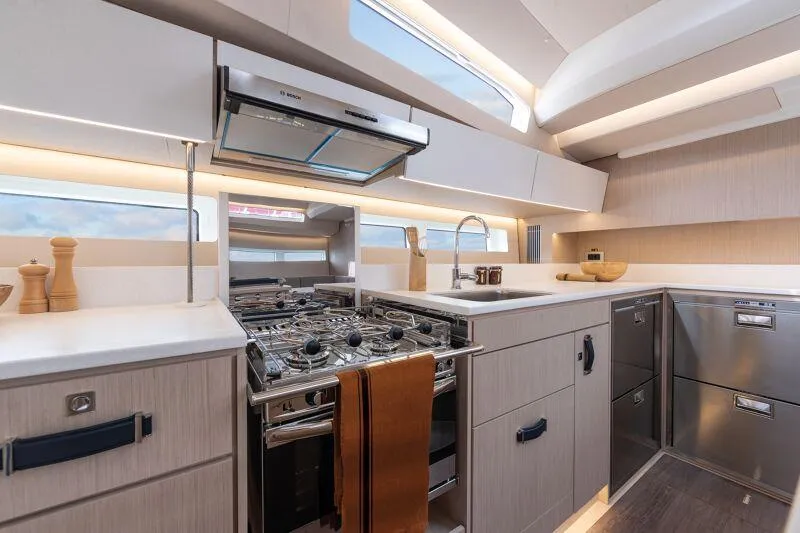 Slide: The Image of Luxurious kitchen interior of 2024 Jeanneau Yacht 55 with modern appliances and sleek design. - 3