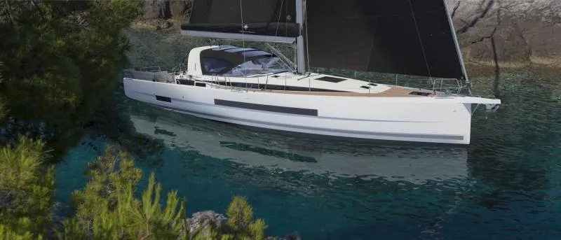 Slide: The Image of 2024 Jeanneau Yacht 55 sailing in clear waters near rocky shoreline. - 4