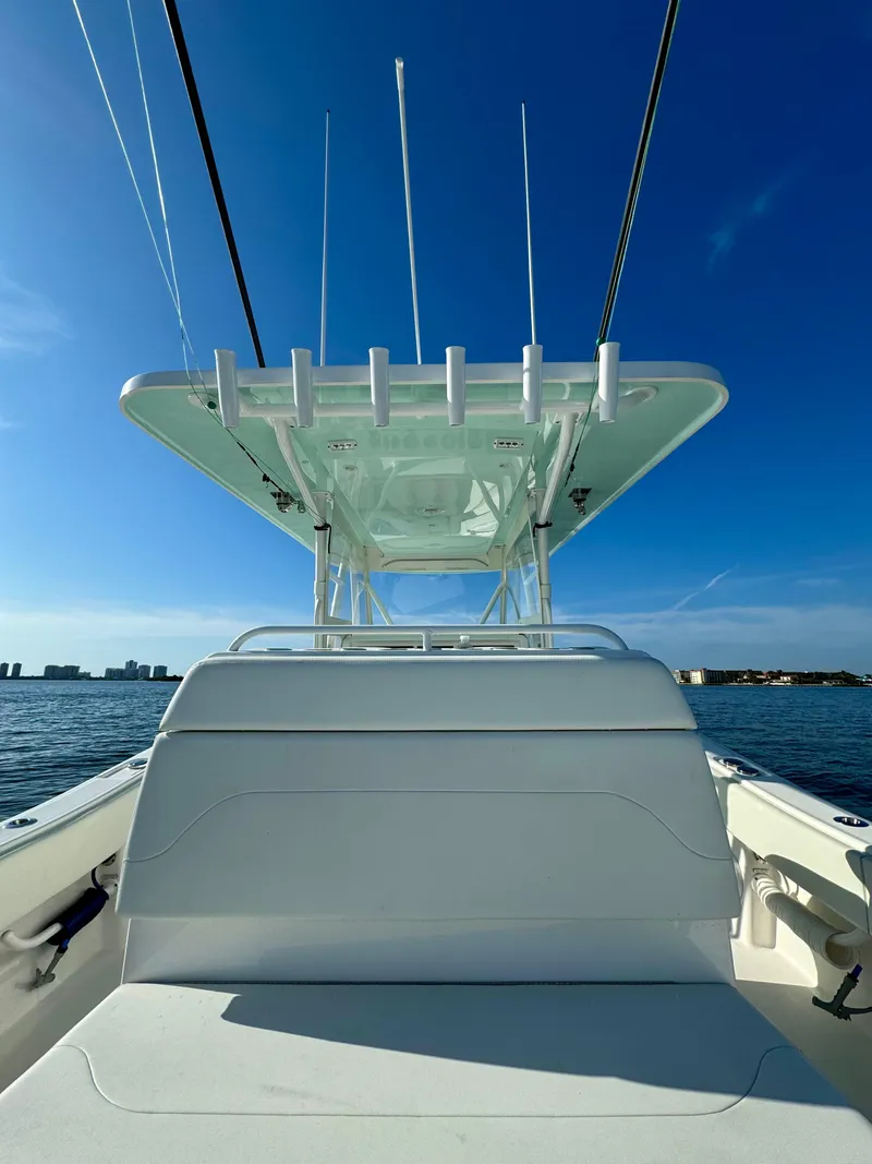 Slide: The Image of 2022 Invincible 39' Open Fisherman boat on calm waters under clear blue sky. - 15