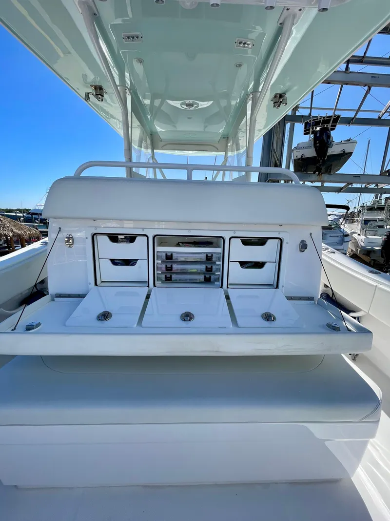 Slide: The Image of 2022 Invincible 39' Open Fisherman boat with storage compartments and sleek design. - 19