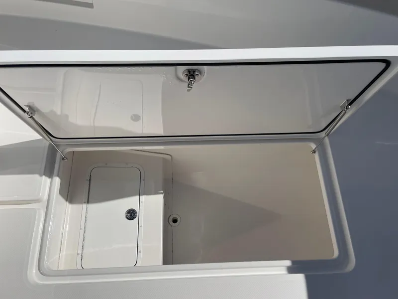 Slide: The Image of Open storage compartment on 2022 Invincible 39' Open Fisherman boat. - 23