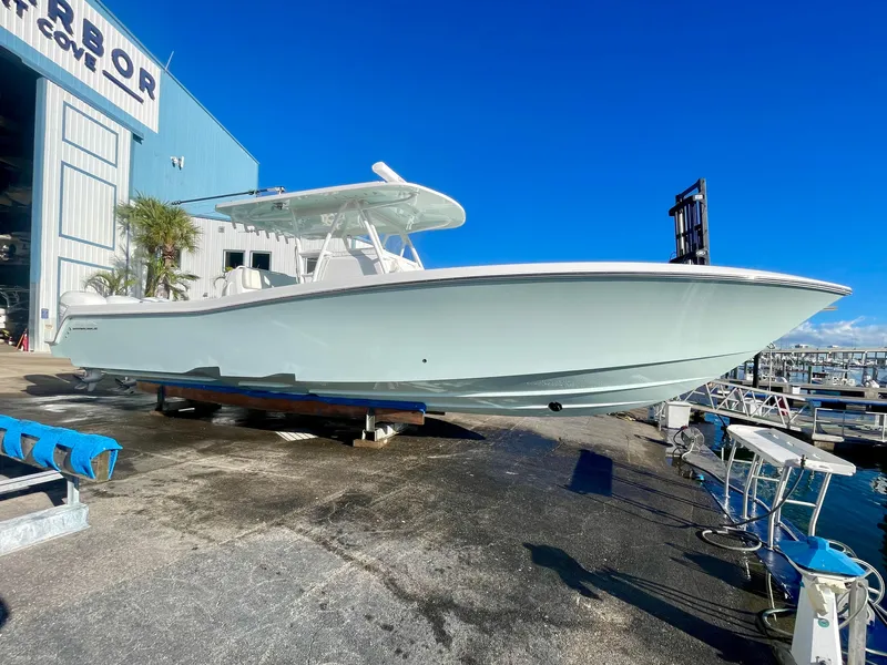 Slide: The Image of 2022 Invincible 39' Open Fisherman boat on dock under clear blue sky. - 30