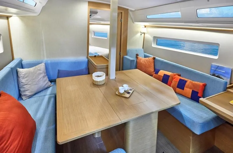 Slide: The Image of 2024 Jeanneau Sun Odyssey 380 interior with cozy seating and modern design. - 7