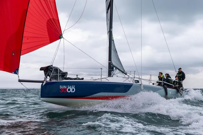 The Image of 2024 Jeanneau SUNFAST 30 ONE DESIGN sailing with red spinnaker on choppy waters. - 0