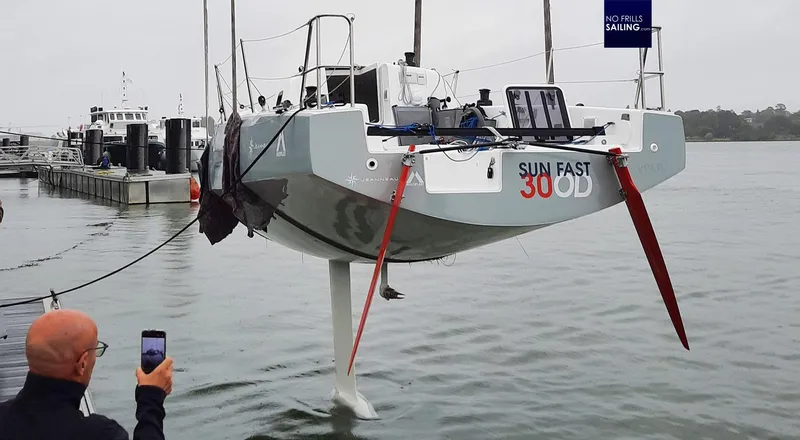 Slide: The Image of 2024 Jeanneau SUNFAST 30 ONE DESIGN sailboat being launched at a marina. - 3