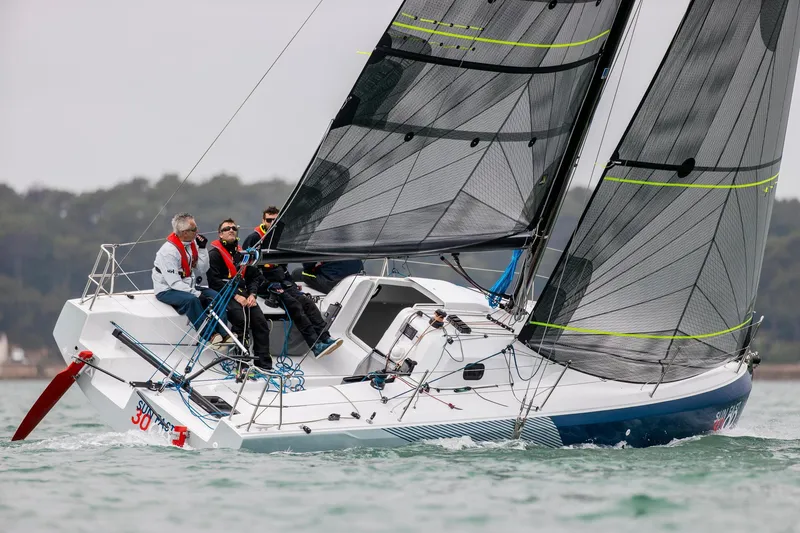 Slide: The Image of 2024 Jeanneau SUNFAST 30 ONE DESIGN sailboat on water with crew sailing. - 4