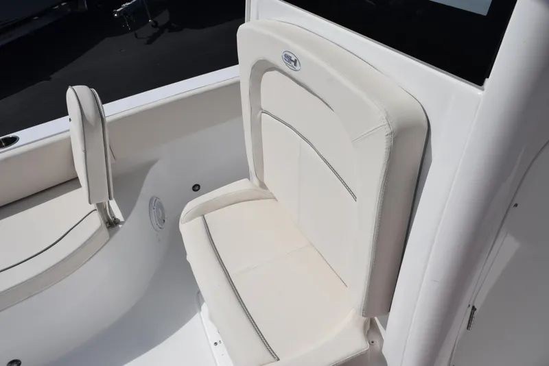 Slide: The Image of 2024 Sea Hunt Escape 25 boat seating, featuring white cushioned seats and sleek design. - 16