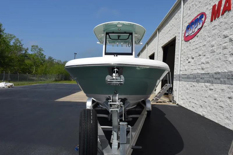 Slide: The Image of 2024 Sea Hunt Escape 25 boat on trailer outside dealership building. - 3