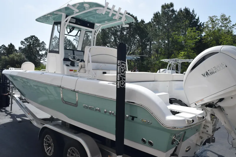 Slide: The Image of 2024 Sea Hunt Escape 25 boat on trailer, featuring sleek design and powerful engine. - 6