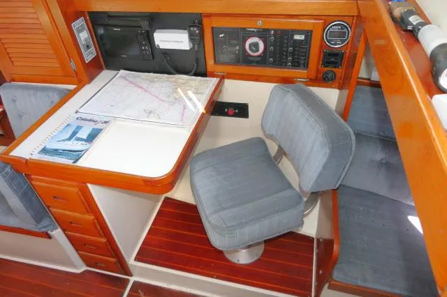 Slide: The Image of Navigation station of a 1991 Catalina 36 sailboat with chart table and instruments. - 16