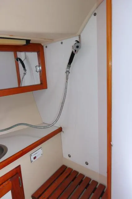 Slide: The Image of Interior of 1991 Catalina 36 sailboat with shower and wooden accents. - 34