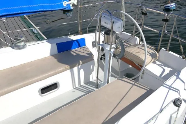 Slide: The Image of 1991 Catalina 36 sailboat cockpit with seating and steering wheel. - 37
