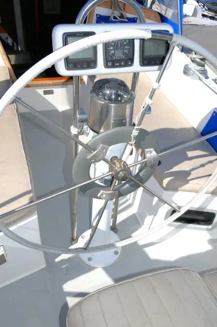 Slide: The Image of Steering wheel and navigation instruments of a 1991 Catalina 36 sailboat. - 39