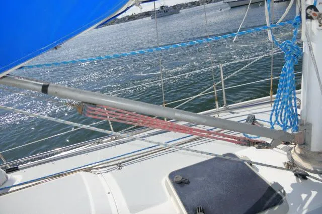 Slide: The Image of 1991 Catalina 36 sailboat deck with rigging and blue ropes. - 44