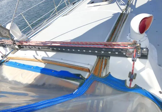 Slide: The Image of Close-up of 1991 Catalina 36 sailboat deck with rigging and blue trim. - 45
