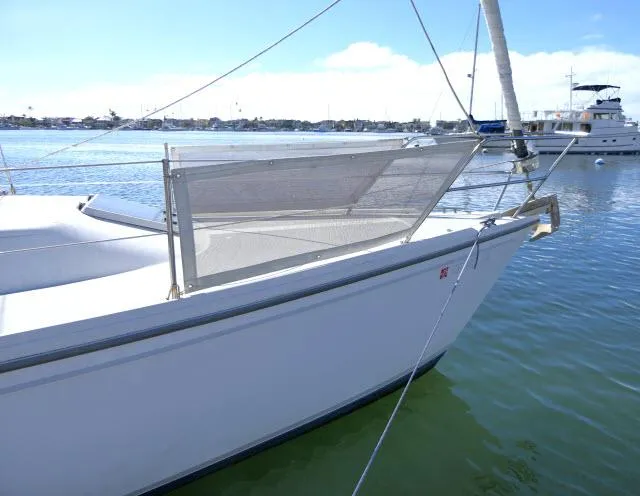 Slide: The Image of 1991 Catalina 36 sailboat docked in a marina. - 49