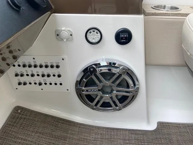 Slide: The Image of 2017 Formula 350 Sun Sport boat dashboard with JL Audio speaker and control panel. - 15