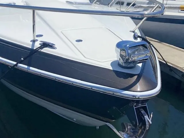 Slide: The Image of 2017 Formula 350 Sun Sport boat docked, showcasing sleek bow design. - 8