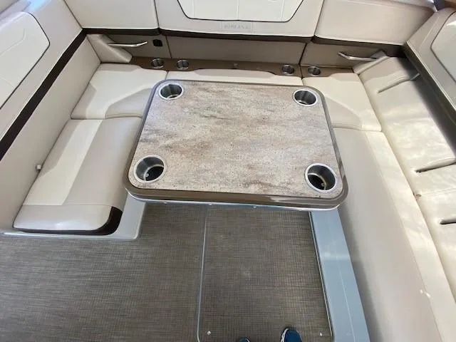 Slide: The Image of 2017 Formula 350 Sun Sport boat interior with beige seating and a central table. - 19