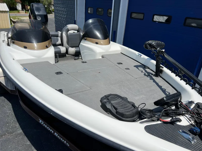 Slide: The Image of 2000 Triton TR170C fishing boat with dual seats and trolling motor. - 10