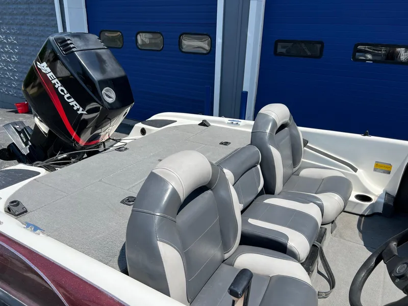 Slide: The Image of 2000 Triton TR170C boat with Mercury outboard motor and gray seating. - 12